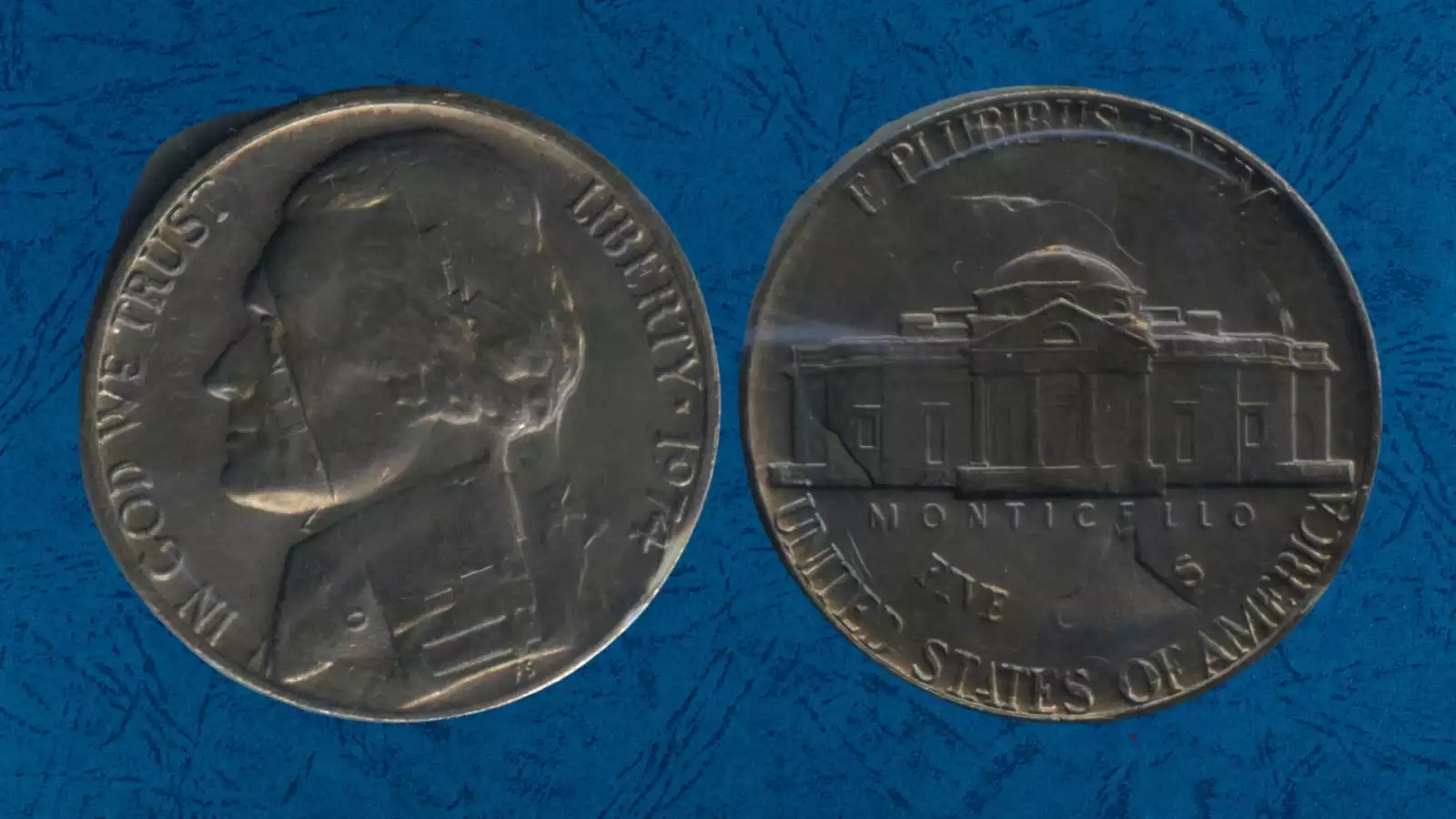 1974 nickel struck over 1973 error showing ghost '3' near E PLURIBUS UNUM on reverse